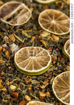 natural green tea with added flavors and pieces of fruit and dried green limes , bright large dry lime slices and green tea with pieces of fruit natural green tea with added flavors and pieces of fruit and dried green limes , bright large dry lime slices and green tea with pieces of fruit 138913457