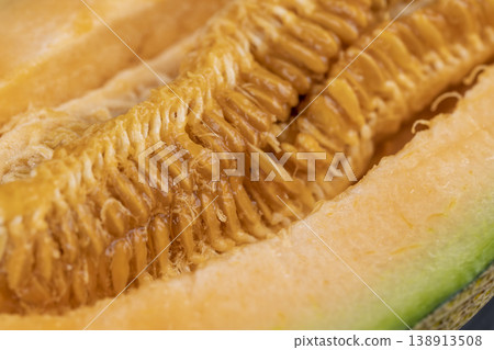 orange melon cut into pieces on a cutting board, cantaloupe slice orange melon cut into pieces on a cutting board, cantaloupe slice 138913508