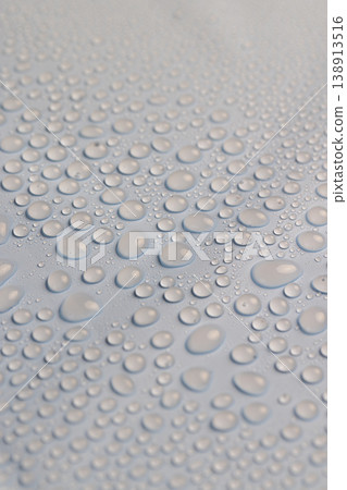 wet blue plastic material for wrapping bouquets, color image 138913516