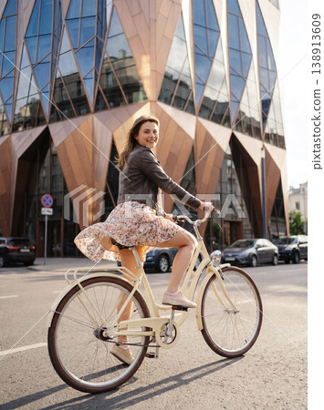Young woman enjoying cycling in modern city Young woman enjoying cycling in modern city 138913609