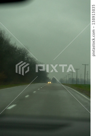 driver's view of the road from car window, the view through the windshield. driver's view of the road from car window, the view through the windshield. 138913835