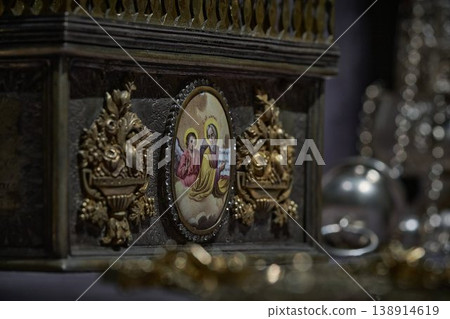Ornate Orthodox church chalice with icon of Jesus Christ, religious liturgical object close up Ornate Orthodox church chalice with icon of Jesus Christ, religious liturgical object close up 138914619