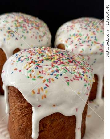 Easter cakes with white icing and sprinkles. A traditional homemade Easter pastry. Easter cakes with white icing and sprinkles. A traditional homemade Easter pastry. 138914646