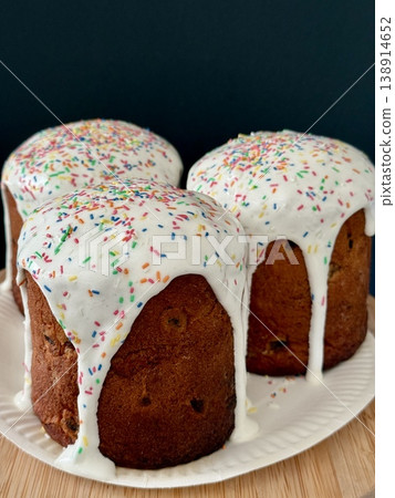 Easter cakes with white icing and sprinkles. A traditional homemade Easter pastry. Easter cakes with white icing and sprinkles. A traditional homemade Easter pastry. 138914652