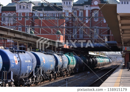 A freight train on the Takasaki Line, consisting of a long string of tank cars, passes through JR Fukaya Station. A freight train on the Takasaki Line, consisting of a long string of tank cars, passes through JR Fukaya Station. 138915179