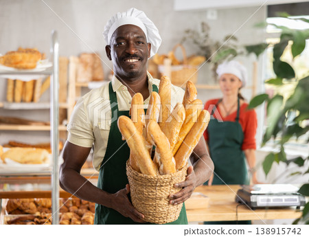 Portrait of positive man bakery worker Portrait of positive man bakery worker 138915742