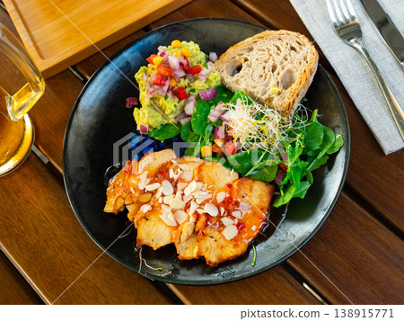 Just cooked portion of chicken breast with spinach and guacamole Just cooked portion of chicken breast with spinach and guacamole 138915771