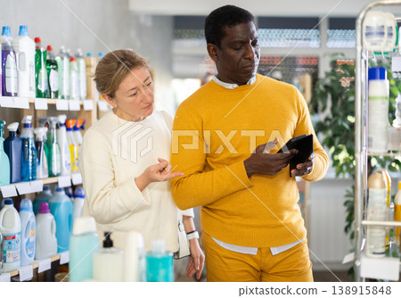 Woman with African American man, looking for something in household shop Woman with African American man, looking for something in household shop 138915848