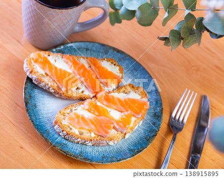Sandwich with salmon served on platter Sandwich with salmon served on platter 138915895