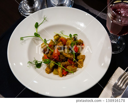 Caponata, chopped fried aubergine with tomatoes and zucchini Caponata, chopped fried aubergine with tomatoes and zucchini 138916178
