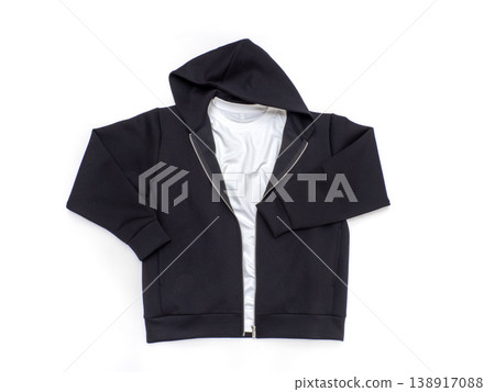 A layered outfit featuring a black zip-up hoodie and a white t-shirt. A layered outfit featuring a black zip-up hoodie and a white t-shirt. 138917088