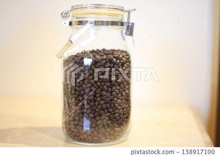 Coffee beans in a glass container Coffee beans in a glass container 138917100