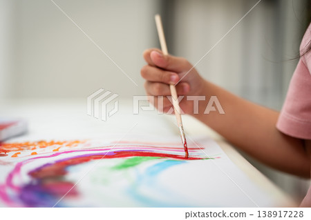 close up of preschool child girl painting on paper with watercolor in pan close up of preschool child girl painting on paper with watercolor in pan 138917228