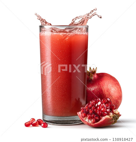 Fresh Pomegranate Juice Splashing in Glass with Whole Fruit on White Background Fresh Pomegranate Juice Splashing in Glass with Whole Fruit on White Background 138918427