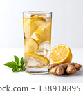 Refreshing Lemon Ginger Drink with Ice Cubes and Fresh Ingredients in Glass 138918895