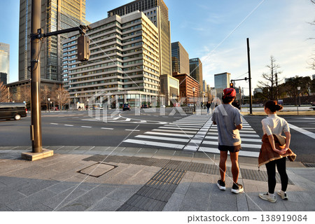 Two runners around the Imperial Palace waiting at a traffic light Two runners around the Imperial Palace waiting at a traffic light 138919084