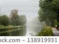 Experience the Misty Canal Serenity Surrounded by Vibrant Lush Greenery for a Truly Idyllic Escape 138919931