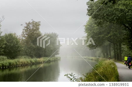 Experience the Misty Canal Serenity Surrounded by Vibrant Lush Greenery for a Truly Idyllic Escape Experience the Misty Canal Serenity Surrounded by Vibrant Lush Greenery for a Truly Idyllic Escape 138919931