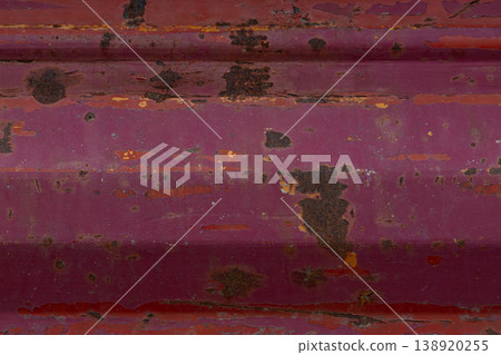 Red rusted painted metal surface texture with peeling industrial wear 138920255