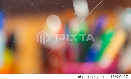 Abstract colorful bokeh background with multicolored blurred light circles through glass Abstract colorful bokeh background with multicolored blurred light circles through glass 138920457