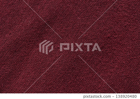 Dark red burgundy knit fabric texture with diagonal weave pattern background close-up Dark red burgundy knit fabric texture with diagonal weave pattern background close-up 138920480