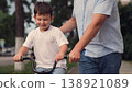 father teaches child ride bike, boy laughs smiling sitting bike outdoors, horse riding, boy laugh smile face, child riding bike, boy brown hair, child boy toothless smile, kid dental surgery, loss 138921089