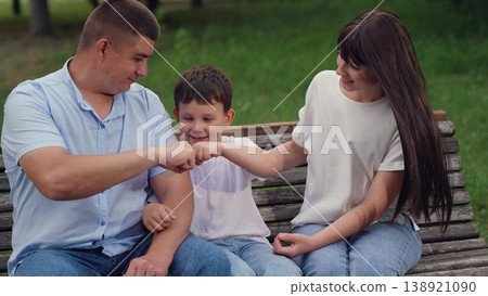 man woman play child boy park, happy family, teamwork, handshake fists, child play dad fist, hand fist, boy child man father smile looking into eyes, friendly team, friendly child game, smile kid dad man woman play child boy park, happy family, teamwork, handshake fists, child play dad fist, hand fist, boy child man father smile looking into eyes, friendly team, friendly child game, smile kid dad 138921090
