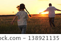 child kid running across field sunset, mother father child park, family silhouette, friendly team people park, man hand holding, Father mother and child running into the sunset, happy family in nature 138921135