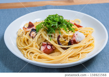 Japanese-style pasta with octopus and perilla leaves, spaghetti with simple seasoning. Japanese-style pasta with octopus and perilla leaves, spaghetti with simple seasoning. 138921568