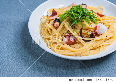 Japanese-style pasta with octopus and perilla leaves, spaghetti with simple seasoning. Japanese-style pasta with octopus and perilla leaves, spaghetti with simple seasoning. 138921570
