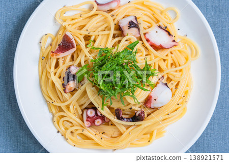 Japanese-style pasta with octopus and perilla leaves, spaghetti with simple seasoning. Japanese-style pasta with octopus and perilla leaves, spaghetti with simple seasoning. 138921571