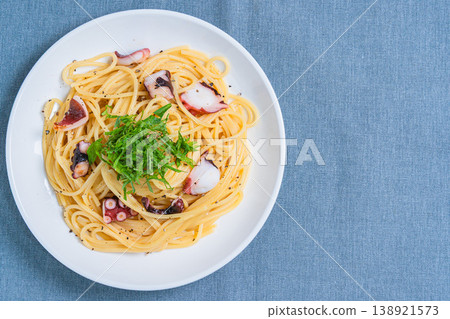 Japanese-style pasta with octopus and perilla leaves, spaghetti with simple seasoning. Japanese-style pasta with octopus and perilla leaves, spaghetti with simple seasoning. 138921573