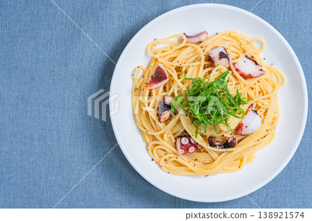 Japanese-style pasta with octopus and perilla leaves, spaghetti with simple seasoning. Japanese-style pasta with octopus and perilla leaves, spaghetti with simple seasoning. 138921574