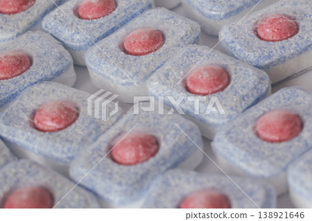 Full frame background pattern of colorful dishwasher detergent tablets and pods Full frame background pattern of colorful dishwasher detergent tablets and pods 138921646