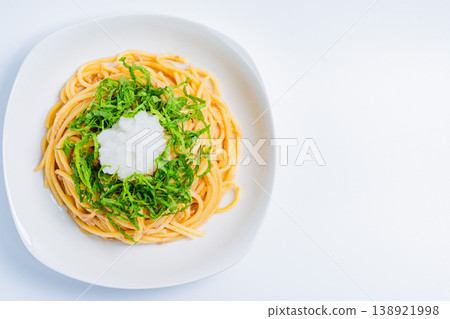 Japanese-style tuna pasta with refreshing spaghetti topped with shiso leaves and grated daikon radish. Japanese-style tuna pasta with refreshing spaghetti topped with shiso leaves and grated daikon radish. 138921998
