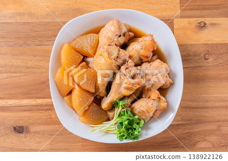 Braised chicken wings and daikon radish - a traditional Japanese home-style dish. 138922126