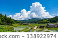 A quintessential Japanese landscape: summer countryside and cumulonimbus clouds, rice paddies after planting. 138922974