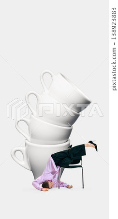 Woman bent backwards under stack of oversized coffee cups overload concept 138923883
