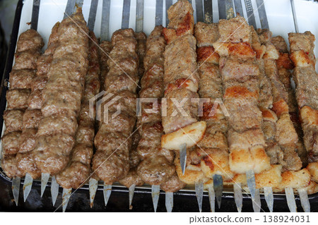 grilled meat on the grill 138924031