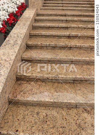 concrete stairs covered with red flowers concrete stairs covered with red flowers 138924043
