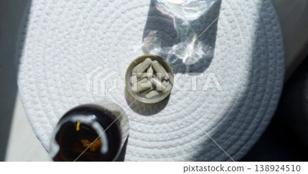 Close-up of iron supplement capsules in a lid for iron deficiency anemia treatment. Health care, wellness, and dietary supplements for daily vitamins and minerals intake. Close-up of iron supplement capsules in a lid for iron deficiency anemia treatment. Health care, wellness, and dietary supplements for daily vitamins and minerals intake. 138924510