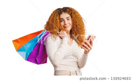 Woman shopping online with smartphone and bags Woman shopping online with smartphone and bags 138924683