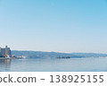 Mountains reflected on the tranquil surface of the lake, a waterside landscape woven from moonlight and islands. 138925155