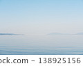 Mountains reflected on the tranquil surface of the lake, a waterside landscape woven from moonlight and islands. 138925156