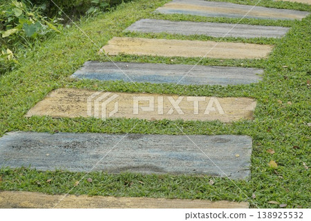 Walkway with a series of different colored stones Walkway with a series of different colored stones 138925532