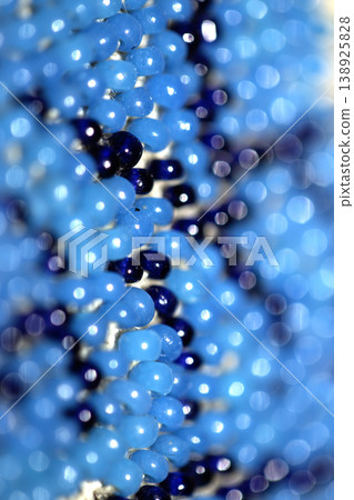 Cute craft small glass beads in an abstract pattern for background 138925828