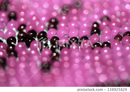 Cute craft small glass beads in an abstract pattern for background Cute craft small glass beads in an abstract pattern for background 138925829