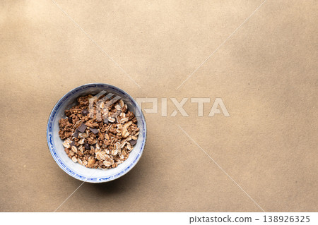 Chocolate granola bowl with oats chocolate 138926325