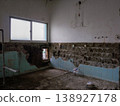 Wall tiles and concrete after the demolition of the traditional bathroom. 138927178