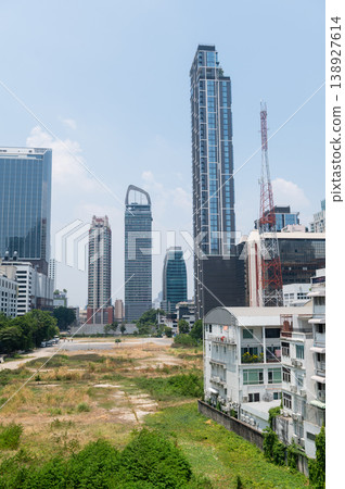 Vacant land surrounded by modern city buildings Vacant land surrounded by modern city buildings 138927614